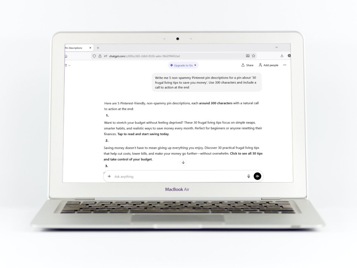 A laptop screen showing an AI chatbot generating Pinterest pin descriptions for a blog post about frugal living tips.